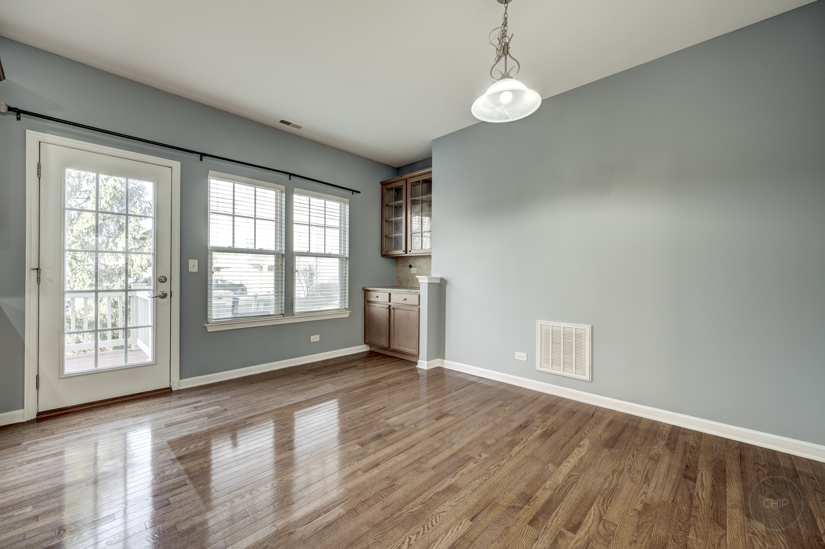 331 North Commerce Street Aurora, IL 60504 - Photo 8 of 41 wooden floor in an empty room with a window