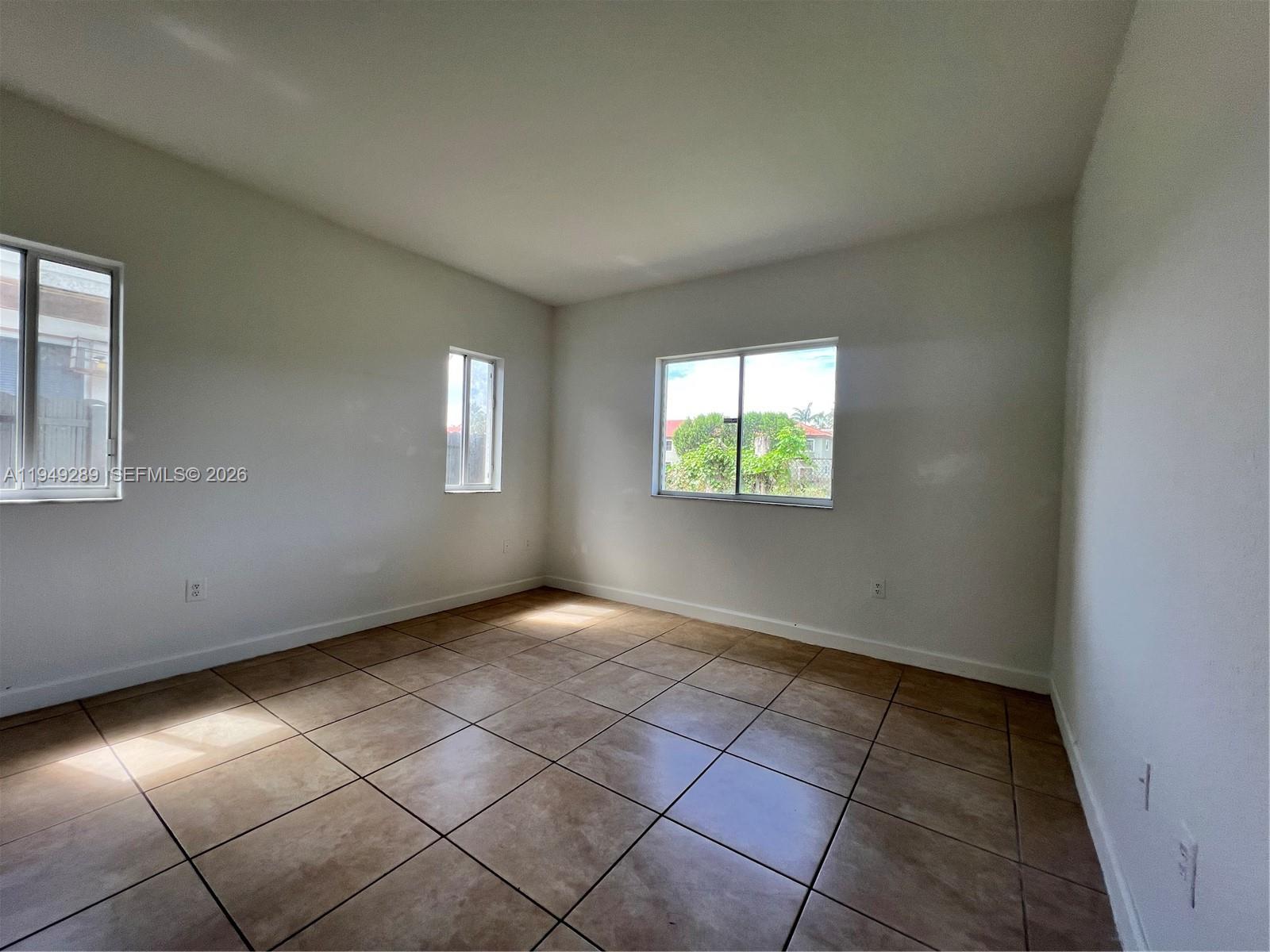 3401 Northeast 4th Street Homestead, FL 33033 - Photo 13 of 15 an empty room with windows