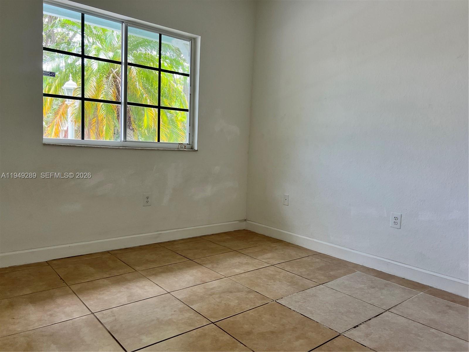 3401 Northeast 4th Street Homestead, FL 33033 - Photo 2 of 15 an empty room with a window