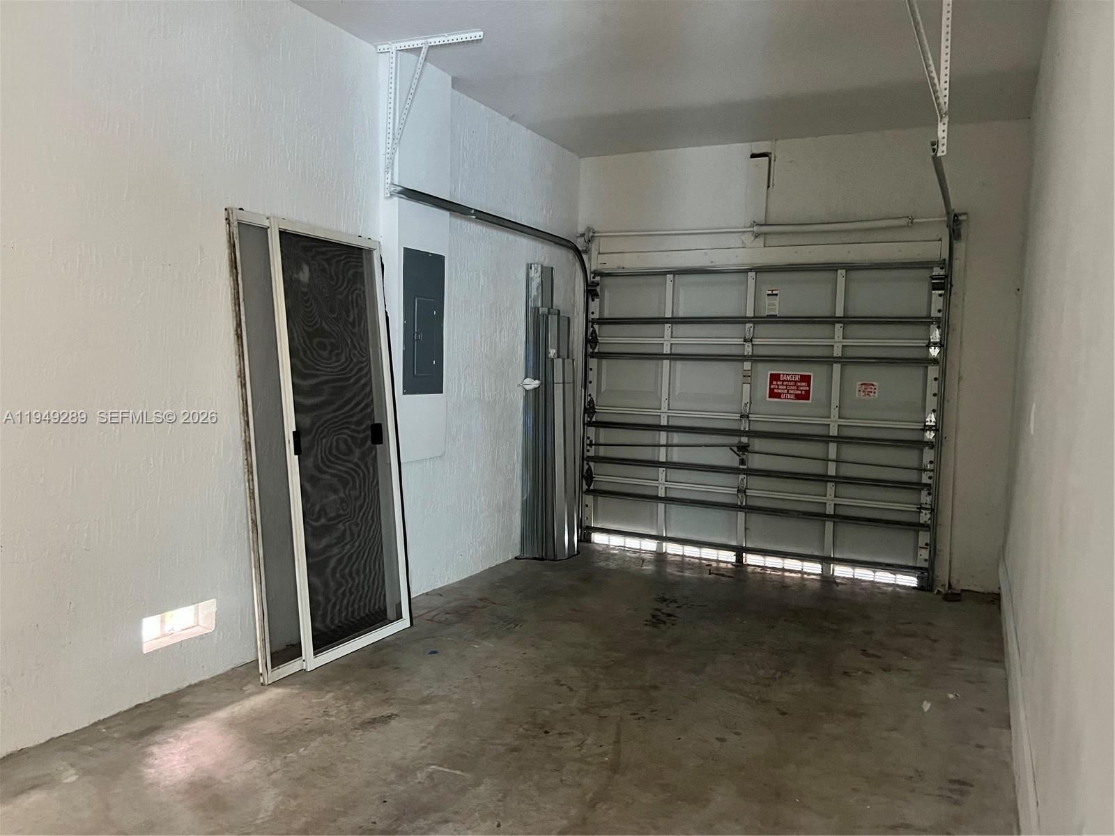3401 Northeast 4th Street Homestead, FL 33033 - Photo 5 of 15 a view of walk in closet with empty racks