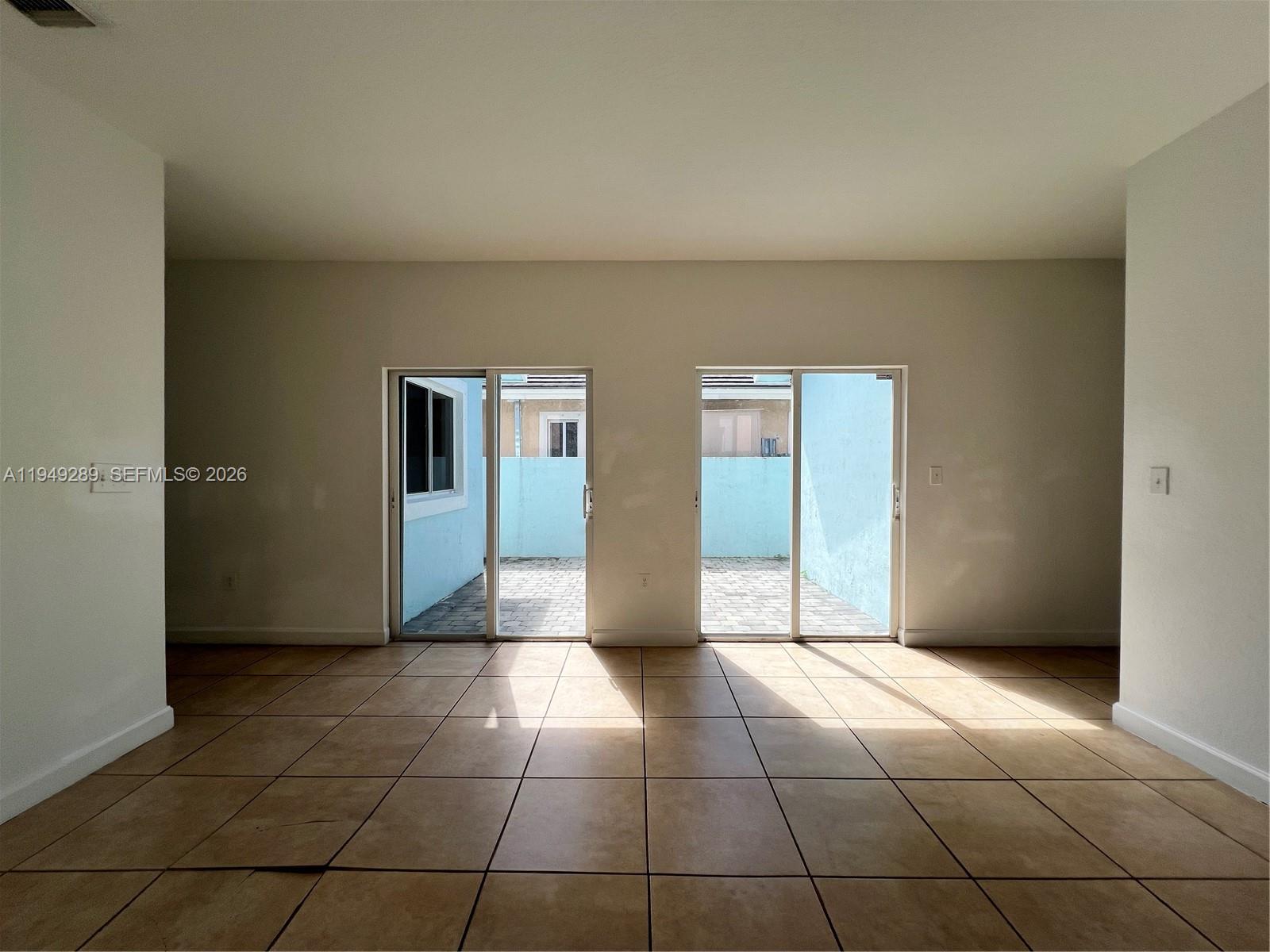 3401 Northeast 4th Street Homestead, FL 33033 - Photo 6 of 15 a view of an empty room with window
