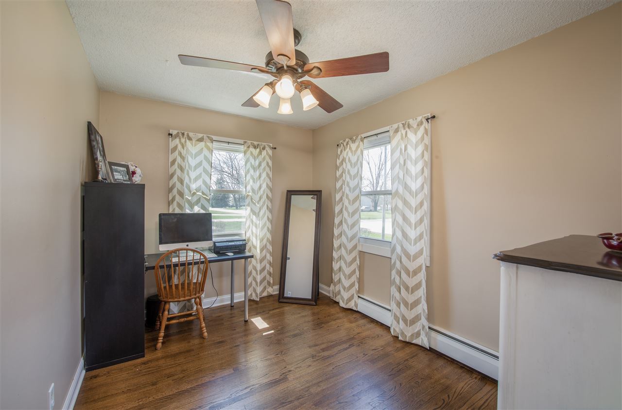 6775 South Sarah Avenue Rochelle, IL 61068 - Photo 17 of 26 a view of workspace with wooden floor fan and windows