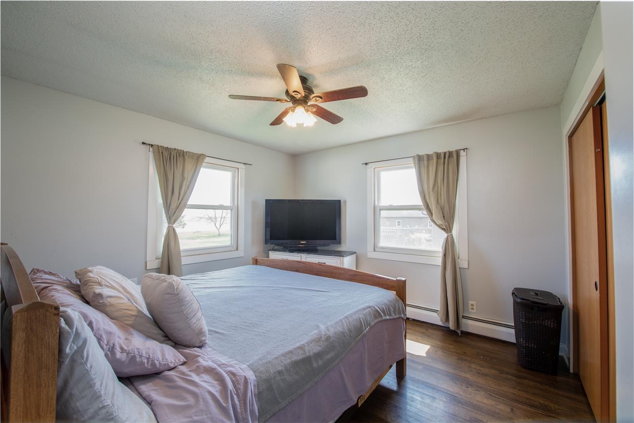 6775 South Sarah Avenue Rochelle, IL 61068 - Photo 19 of 26 a bedroom with a bed and a flat screen tv