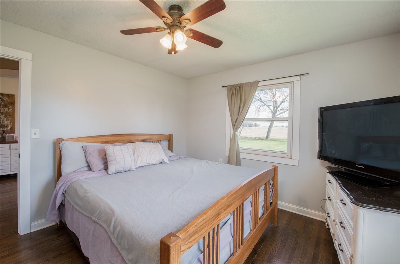 6775 South Sarah Avenue Rochelle, IL 61068 - Photo 20 of 26 a bedroom with a bed and a flat screen tv