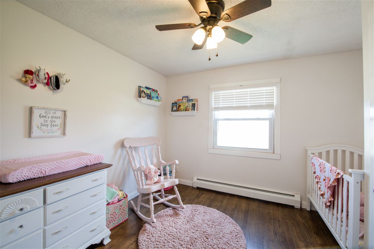 6775 South Sarah Avenue Rochelle, IL 61068 - Photo 21 of 26 a bedroom with furniture and a window