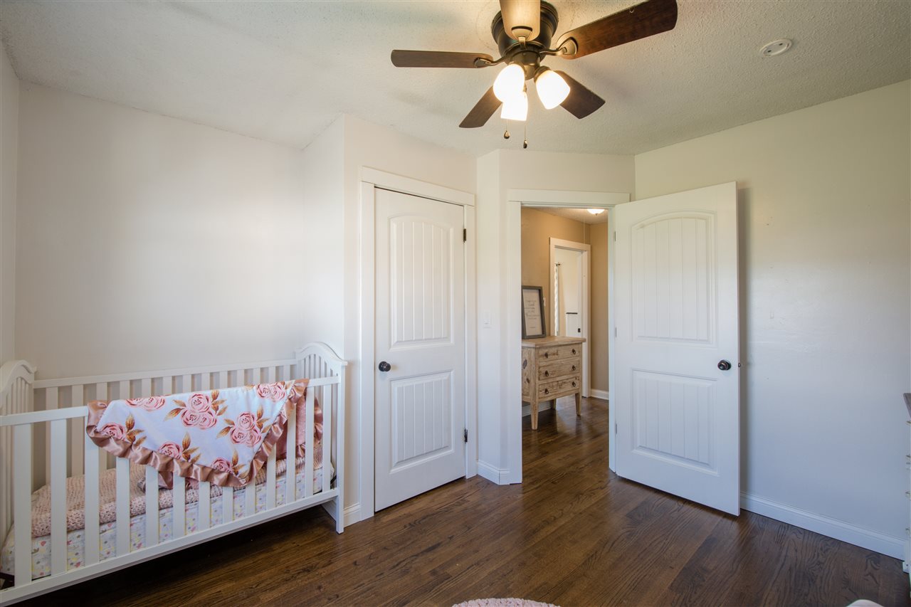 6775 South Sarah Avenue Rochelle, IL 61068 - Photo 22 of 26 an empty room with wooden floor a ceiling fan and closet