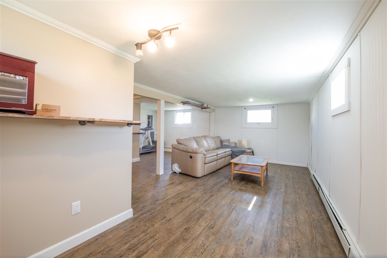 6775 South Sarah Avenue Rochelle, IL 61068 - Photo 25 of 26 a living room with furniture and a wooden floor