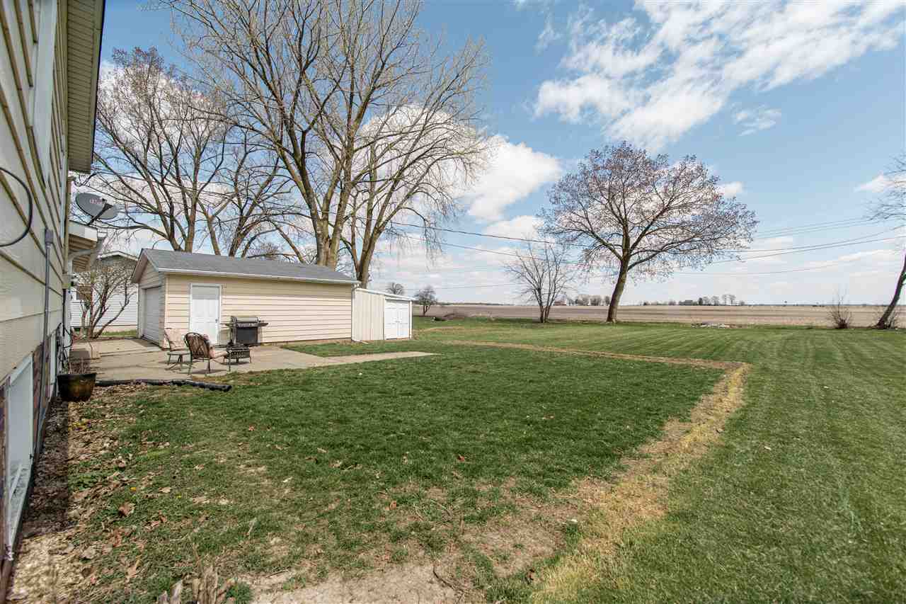 6775 South Sarah Avenue Rochelle, IL 61068 - Photo 5 of 26 a view of a backyard with large tree