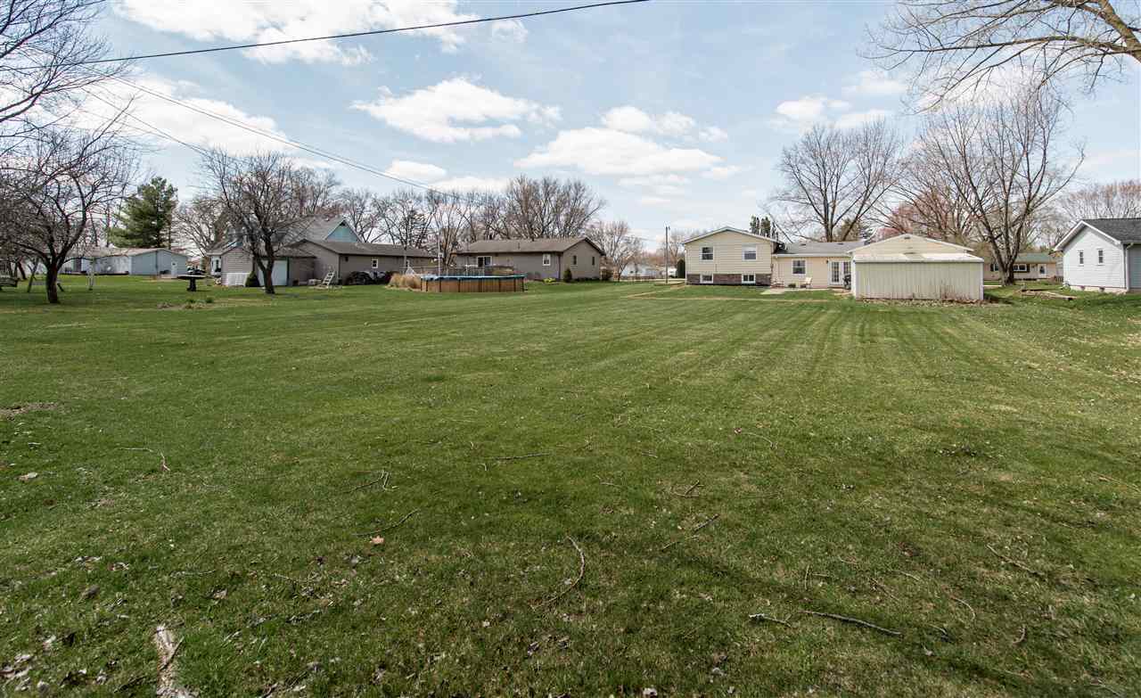 6775 South Sarah Avenue Rochelle, IL 61068 - Photo 7 of 26 a view of grassy field with benches
