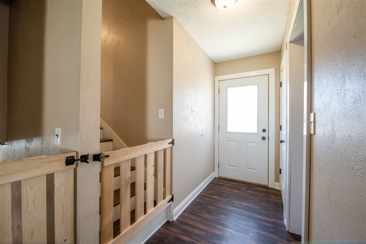 6775 South Sarah Avenue Rochelle, IL 61068 - Photo 9 of 26 a view of a hallway with wooden floor