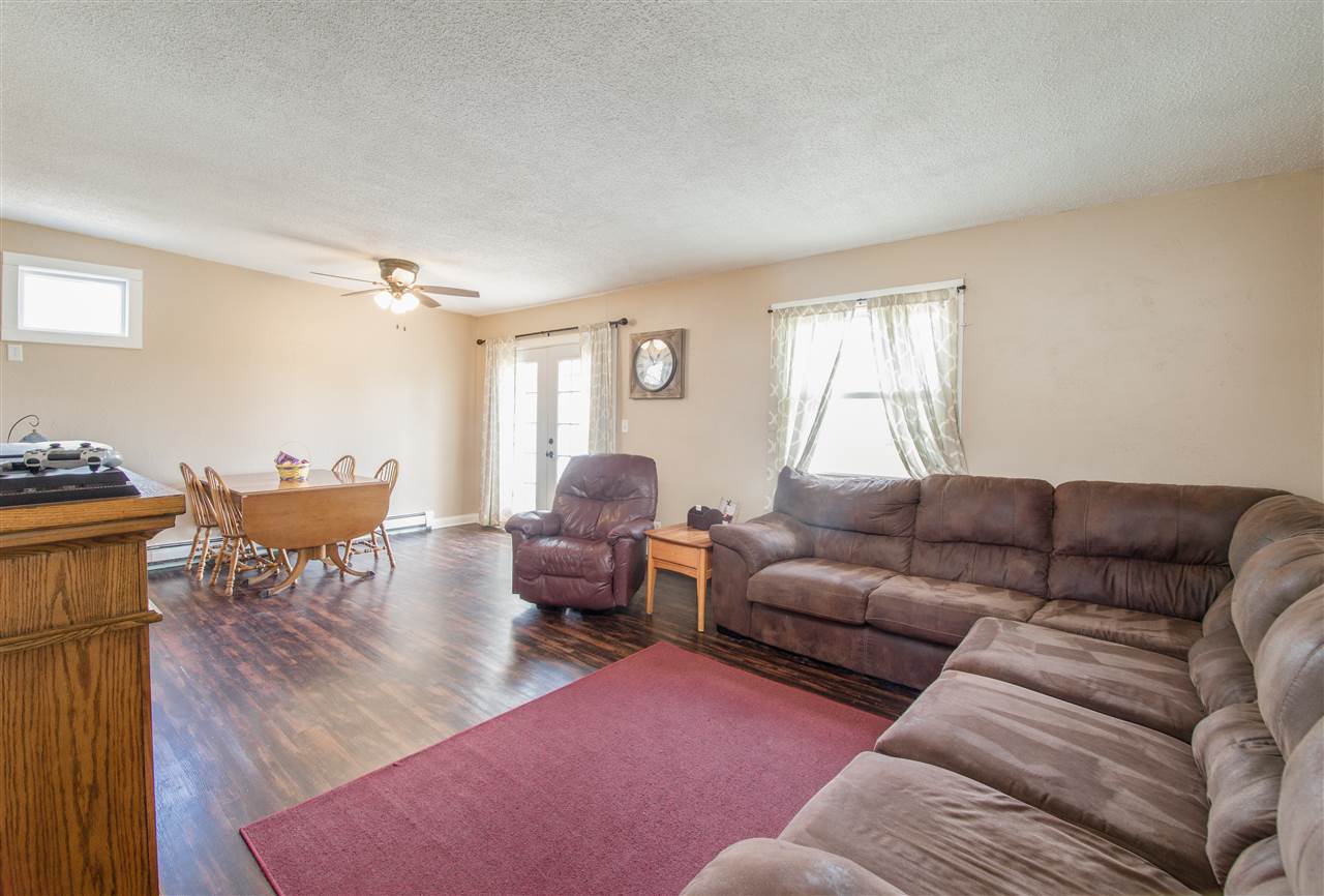 6775 South Sarah Avenue Rochelle, IL 61068 - Photo 10 of 26 a living room with furniture and a window