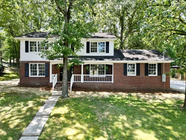 a house view with a garden space