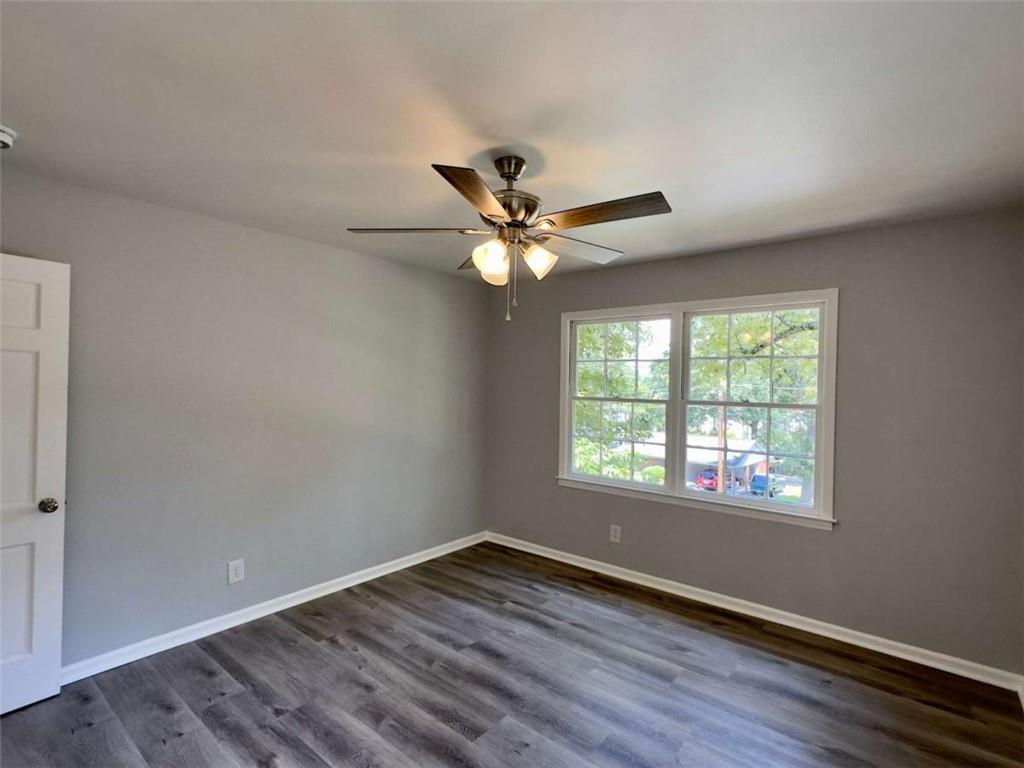 6 Westlyn Drive Rome, GA 30165 - Photo 23 of 25 a view of an empty room with wooden floor and a window