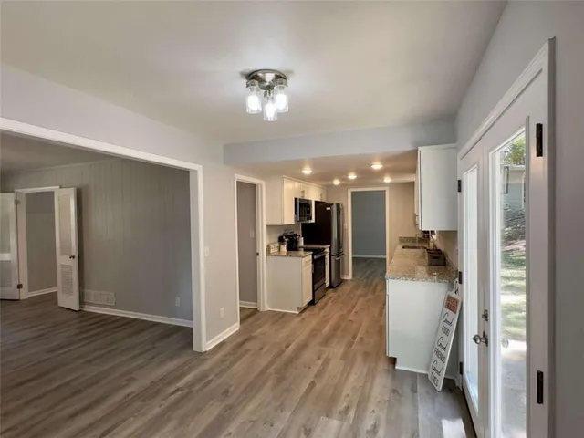 a view of a living room and a wooden floor