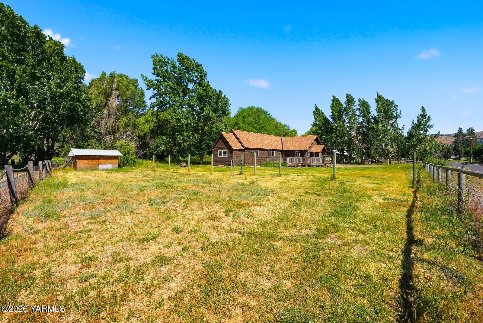 3780 Nile Road Naches, WA 98937 - Photo 31 of 43 a swimming pool with some trees in the background