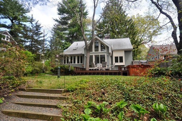 24 Prospect Hill Road Lexington, MA 02421 - Photo 19 of 22 a front view of a house with a garden