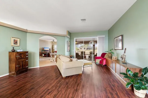 a view of a dining room with furniture and a chandelier
