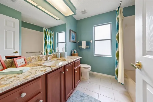 an aerial view of a house with a swimming pool