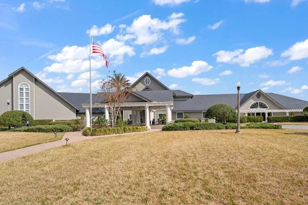 a view of a patio with a table and chairs