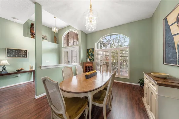 a spacious bathroom with a tub a double vanity sink and a large mirror