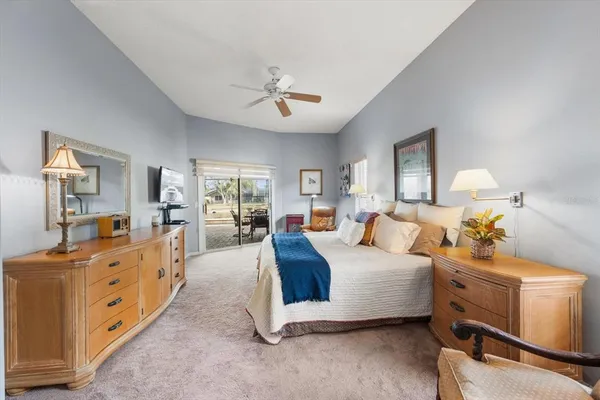 a large bathroom with a granite countertop tub a sink a large mirror and a shower