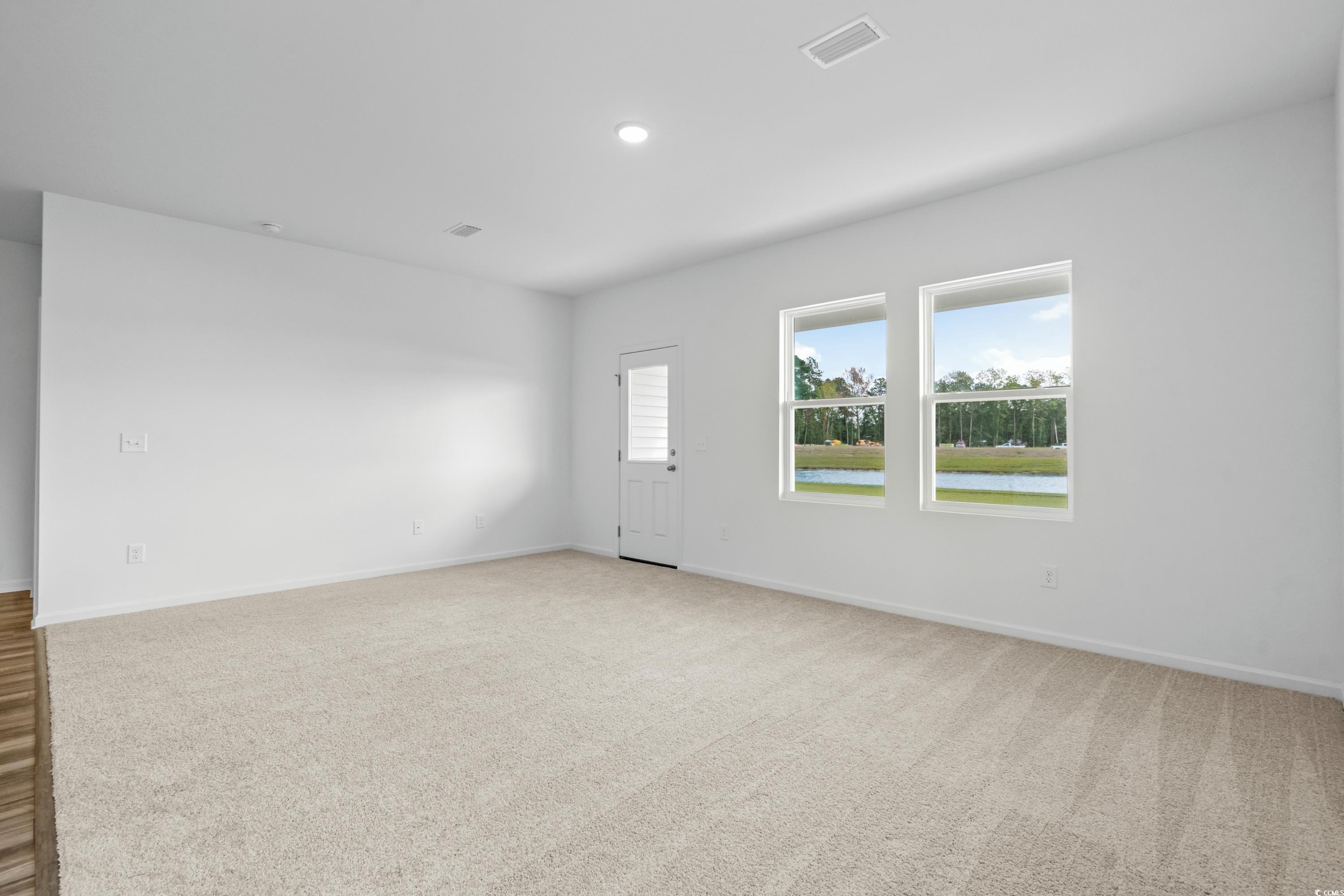 435 Castillo Drive Longs, SC 29568 - Photo 13 of 27 Empty room with a water view, light carpet, and recessed lighting