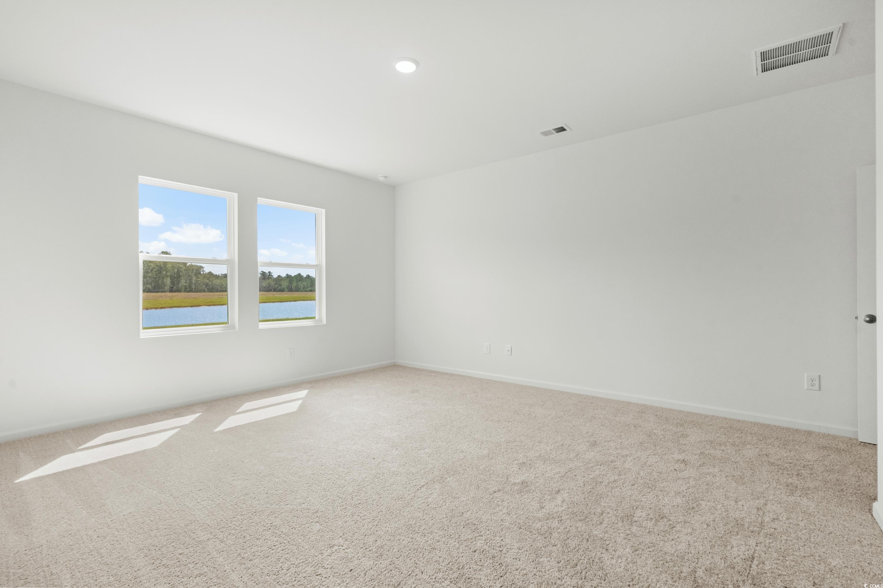 435 Castillo Drive Longs, SC 29568 - Photo 17 of 27 Spare room with carpet floors, a water view, and recessed lighting