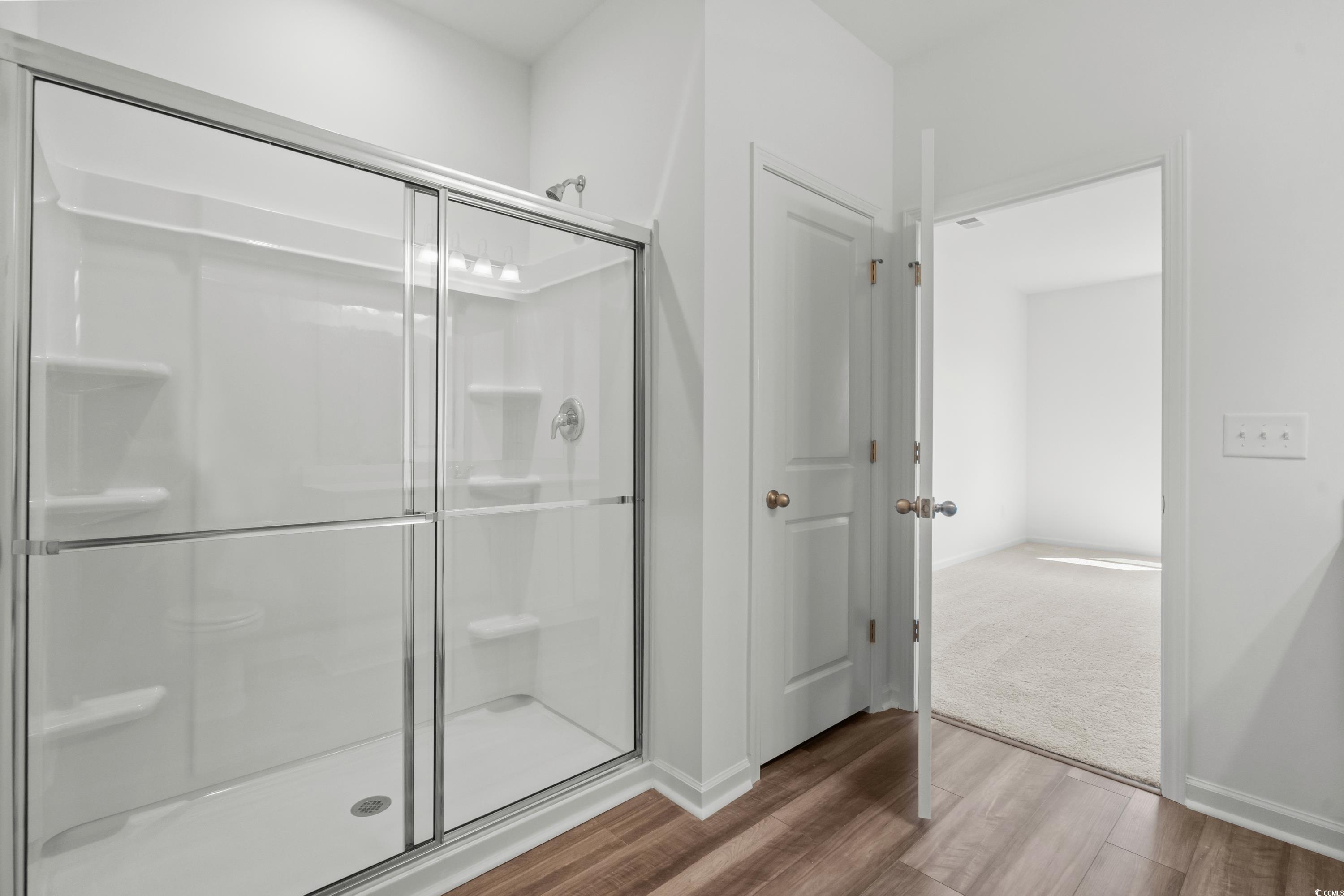 435 Castillo Drive Longs, SC 29568 - Photo 21 of 27 Full bathroom featuring a shower stall and wood finished floors