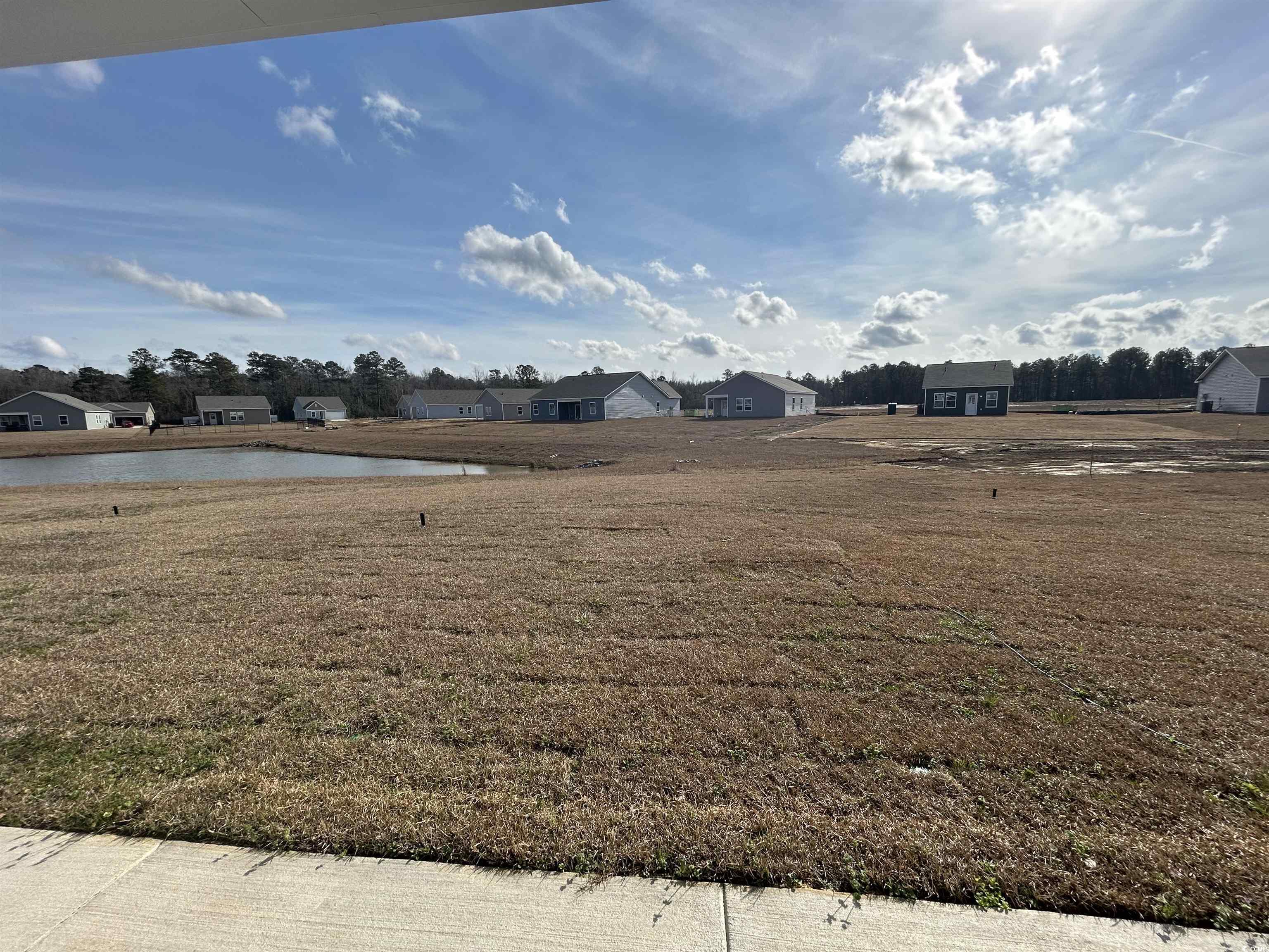 435 Castillo Drive Longs, SC 29568 - Photo 23 of 27 View of yard featuring a residential view and a water view