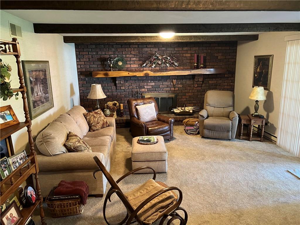 200 Courtland Road Indiana, PA 15701 - Photo 12 of 42 a living room with furniture a flat screen tv and a fireplace