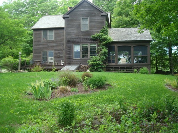 1379 W Road Ashfield, MA 01330 - Photo 4 of 30 a front view of a house with garden