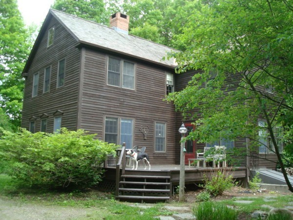 1379 W Road Ashfield, MA 01330 - Photo 6 of 30 a front view of a house with a garden