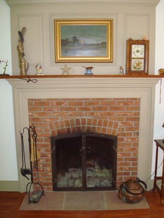 1379 W Road Ashfield, MA 01330 - Photo 9 of 30 a close view of a fireplace with wooden floor