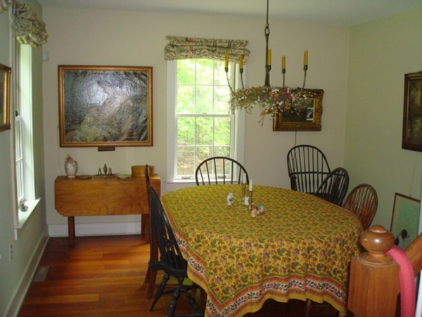 1379 W Road Ashfield, MA 01330 - Photo 10 of 30 a bed sitting in a bedroom next to a window