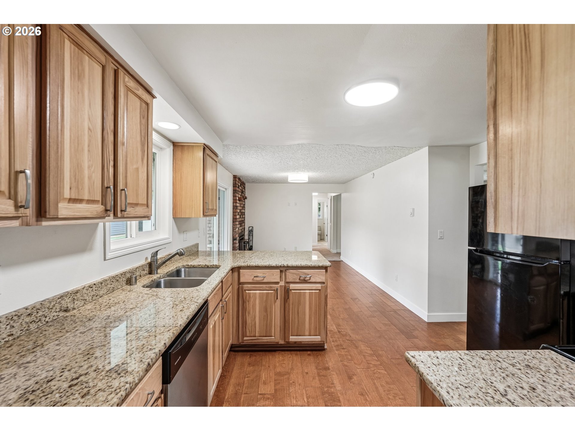 22600 Northeast 28th Street Camas, WA 98607 - Photo 11 of 48 a kitchen with a sink a counter top space stainless steel appliances cabinets and a large window