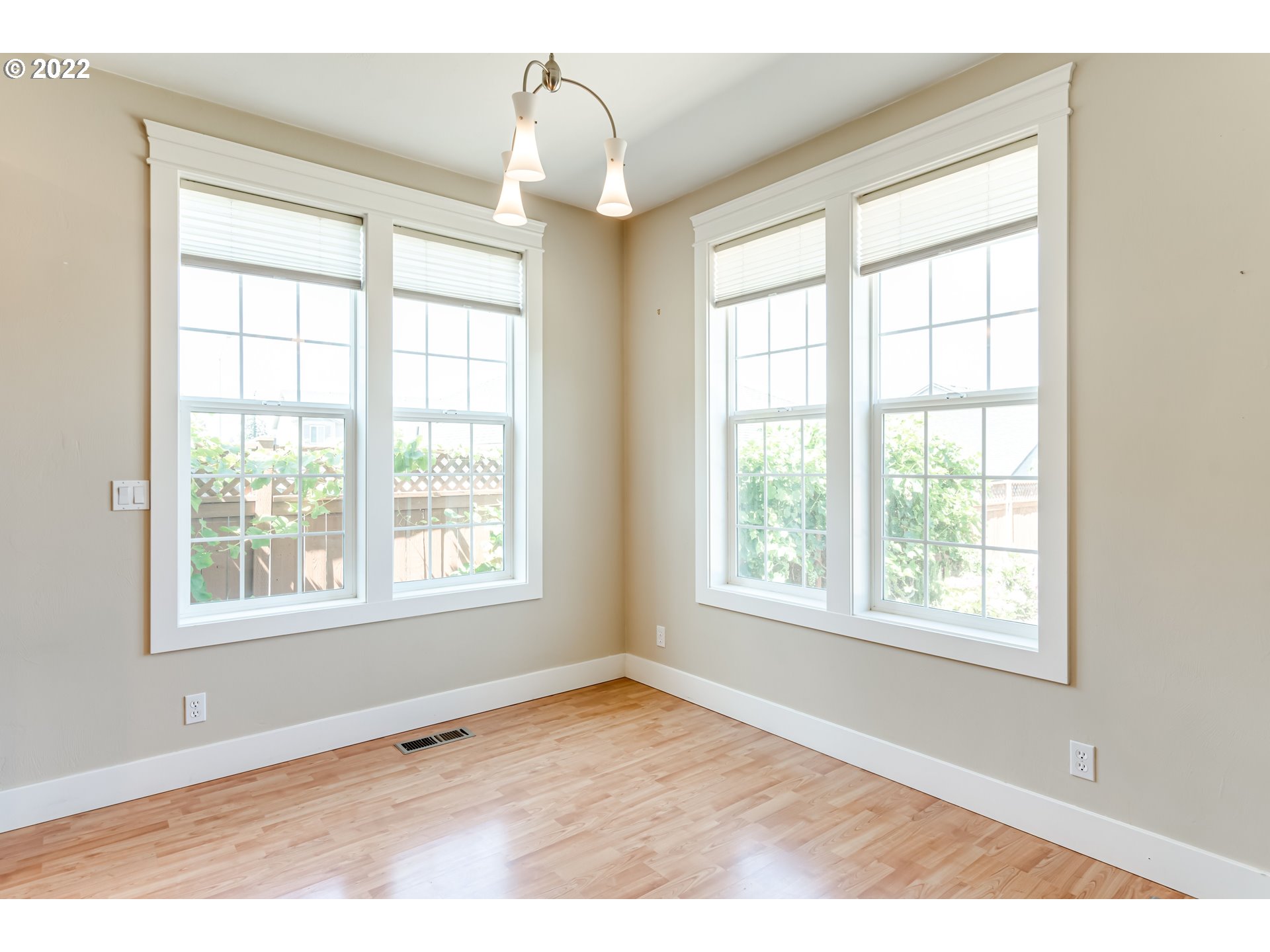 4750 Rocky Road Springfield, OR 97478 - Photo 11 of 32 an empty room with wooden floor and windows