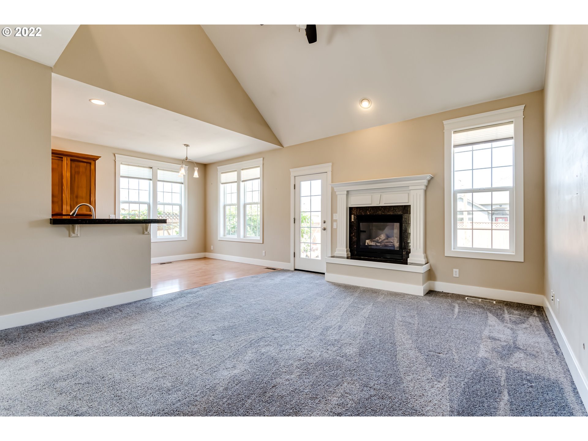 4750 Rocky Road Springfield, OR 97478 - Photo 13 of 32 a view of an empty room with a fireplace and a window