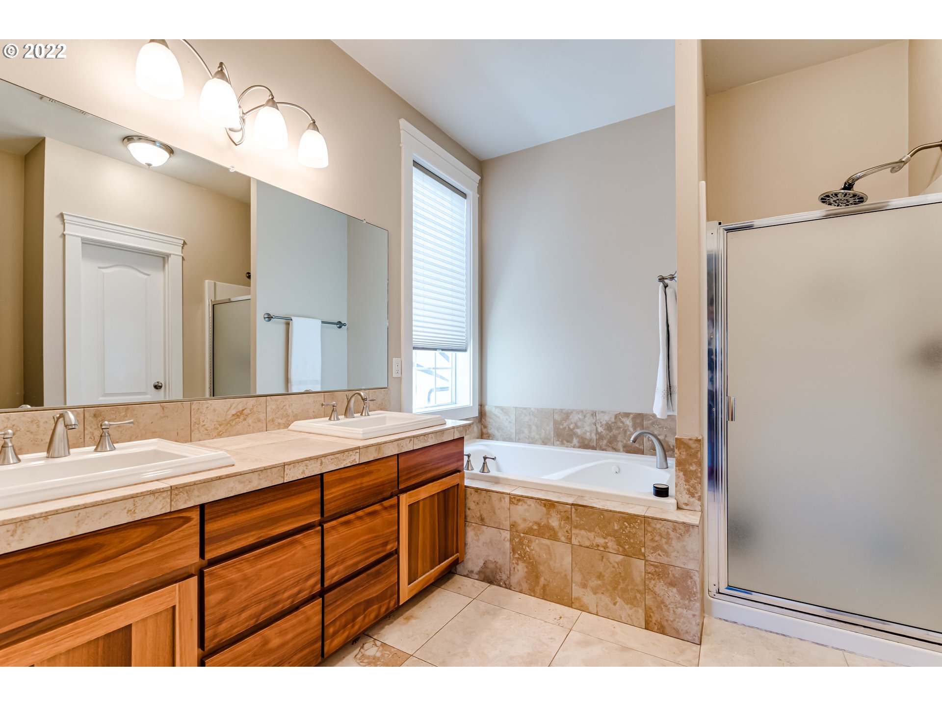 4750 Rocky Road Springfield, OR 97478 - Photo 18 of 32 a bathroom with a sink double vanity granite tub shower and a mirror