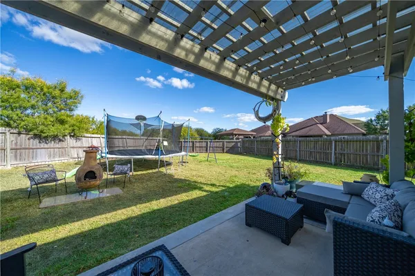 a outdoor living space with furniture and a potted plant