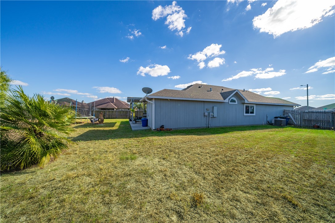 7442 Russ Lane Corpus Christi, TX 78414 - Photo 27 of 29 a front view of a house with garden