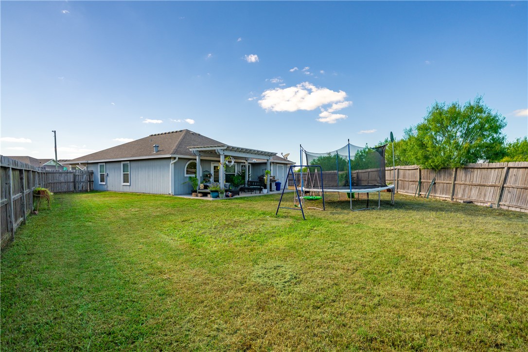 7442 Russ Lane Corpus Christi, TX 78414 - Photo 28 of 29 a view of a house with a swimming pool