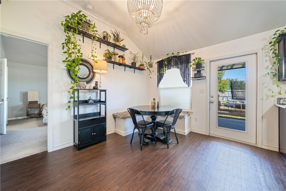 7442 Russ Lane Corpus Christi, TX 78414 - Photo 9 of 29 a view of a dining room with furniture and wooden floor