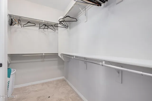 a spacious bathroom with a double vanity sink a mirror and a shower