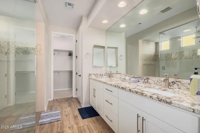 a spacious bedroom with a bed and a window