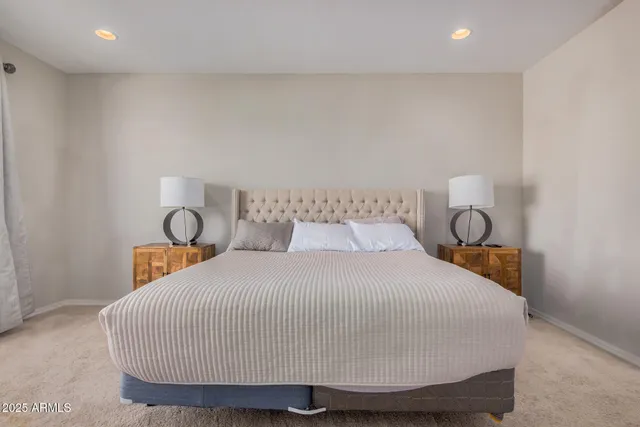 a bathroom with a granite countertop sink a toilet and a mirror