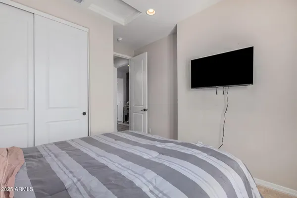 a bedroom with a bed and window