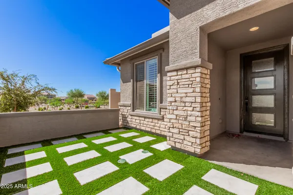 a view of a dining room with furniture and window