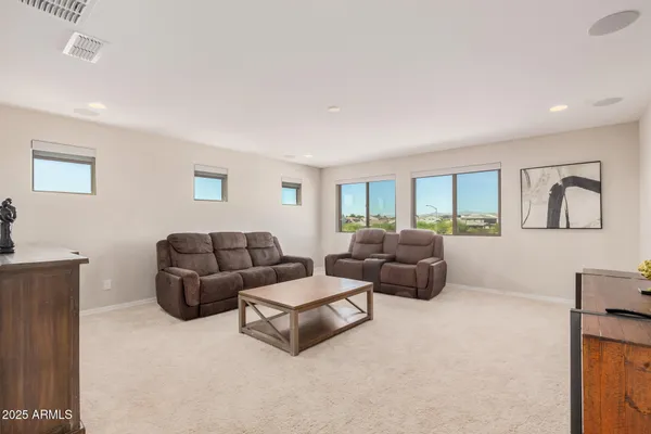 a bedroom with two beds and painted walls