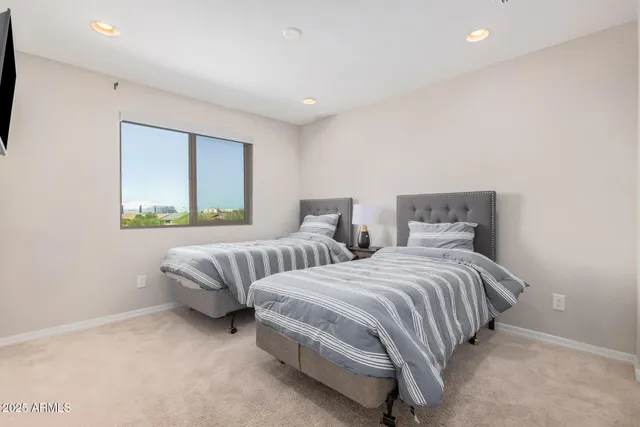 a bedroom with a bed and a window