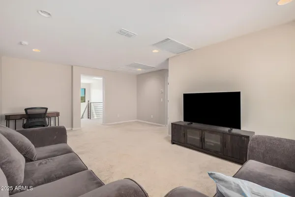 an aerial view of a house with a garden and trees